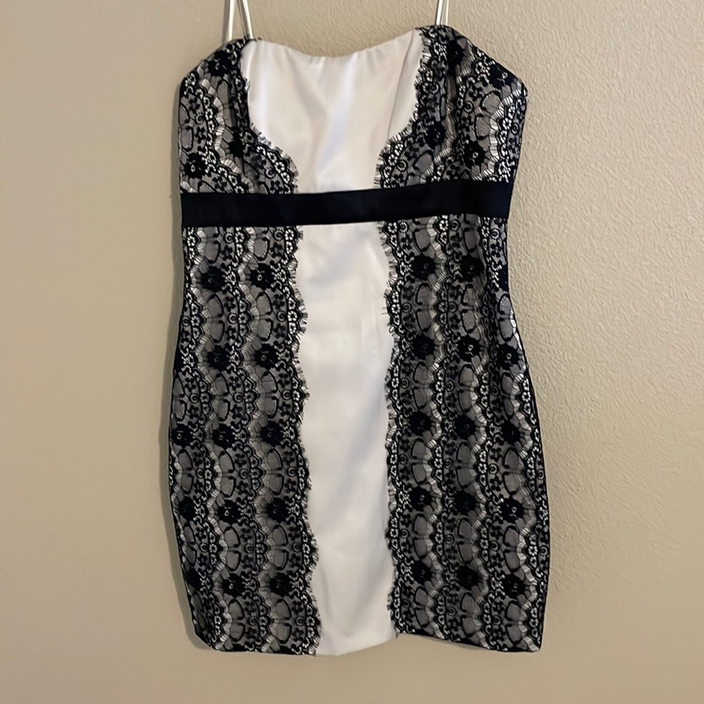 Max and Cleo size 12 champagne colored dress with black lace. 29” in length.